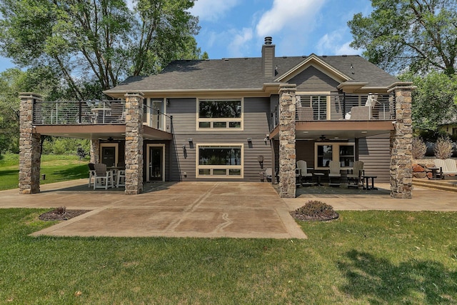27806 Sundance Ln, Cold Spring, MN 56320 - back of property with a balcony, a patio, a yard, a ceiling fan, and a chimney