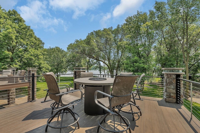 27806 Sundance Ln, Cold Spring, MN 56320 - wooden terrace featuring a fire pit and view of wooded area