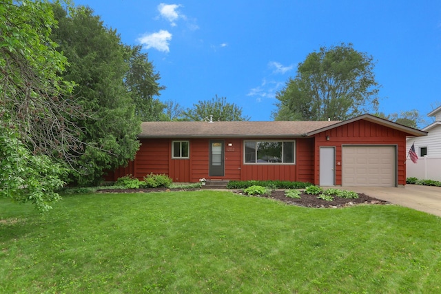 1202 Lyn Way, Hastings, MN 55033 - ranch-style house featuring concrete driveway, board and batten siding, an attached garage, and a front yard