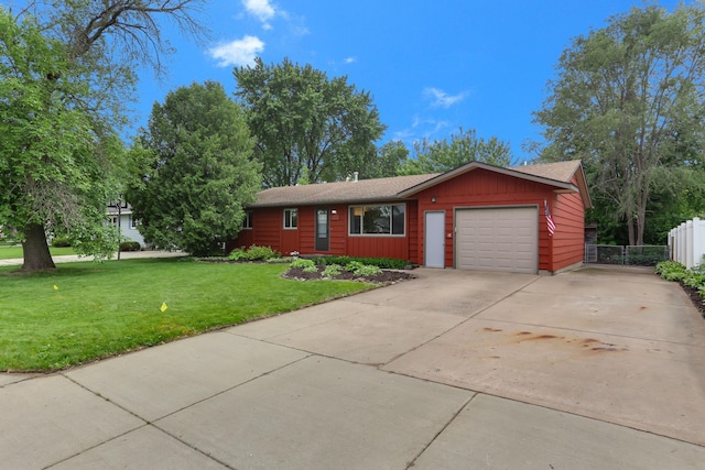 1202 Lyn Way, Hastings, MN 55033 - view of front of property with an attached garage, concrete driveway, and board and batten siding