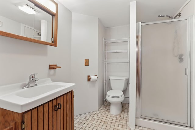 1202 Lyn Way, Hastings, MN 55033 - bathroom featuring a shower stall, toilet, vanity, and tile patterned flooring