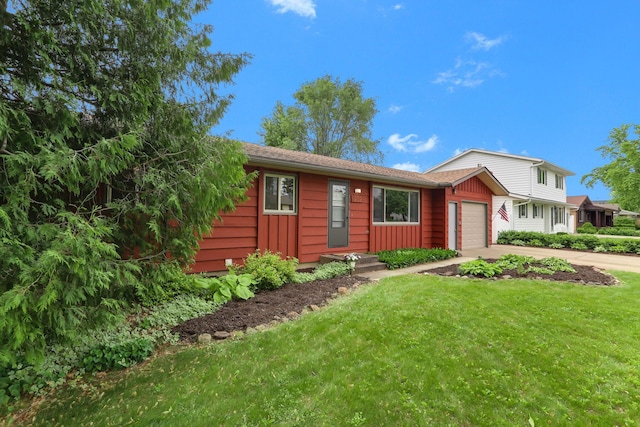 1202 Lyn Way, Hastings, MN 55033 - view of front of home featuring driveway, an attached garage, a front lawn, and board and batten siding