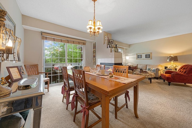 15610 24th Ave N Unit F, Plymouth, MN 55447 - dining area featuring light carpet, a chandelier, and a textured ceiling
