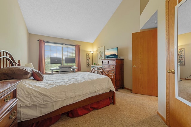 15610 24th Ave N Unit F, Plymouth, MN 55447 - bedroom featuring carpet, a textured ceiling, and high vaulted ceiling