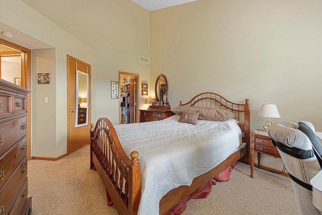 15610 24th Ave N Unit F, Plymouth, MN 55447 - bedroom with light carpet, baseboards, a closet, and a spacious closet