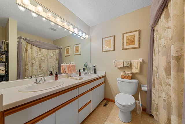 15610 24th Ave N Unit F, Plymouth, MN 55447 - bathroom with toilet, double vanity, tile patterned floors, a textured ceiling, and a shower with curtain