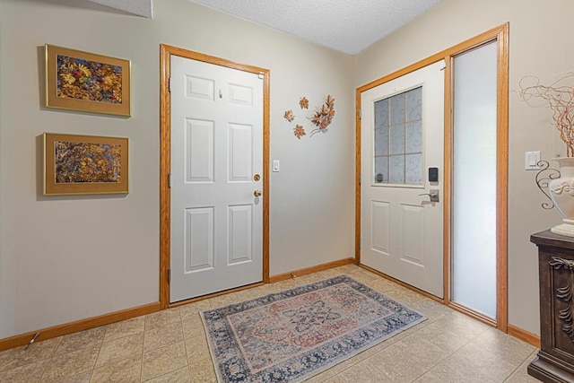 15610 24th Ave N Unit F, Plymouth, MN 55447 - entrance foyer with baseboards and a textured ceiling