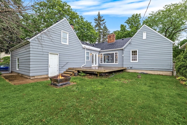 591 Wheelock Pkwy W, Saint Paul, MN 55117 - back of house featuring an outdoor fire pit, a deck, a chimney, and a yard