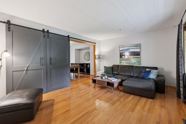 1502 Rocky Ln, Eagan, MN 55122 - living area with a barn door and light wood finished floors