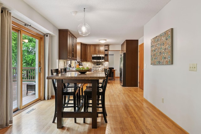 1502 Rocky Ln, Eagan, MN 55122 - dining room with light wood-style floors