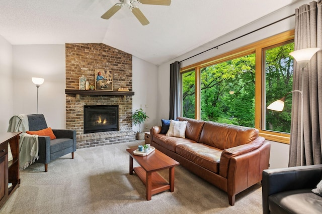 1502 Rocky Ln, Eagan, MN 55122 - carpeted living room with lofted ceiling, healthy amount of natural light, ceiling fan, and a fireplace