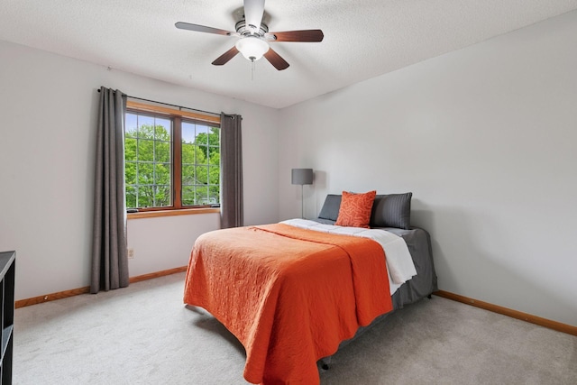 1502 Rocky Ln, Eagan, MN 55122 - bedroom featuring light carpet, baseboards, a textured ceiling, and ceiling fan