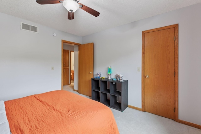 1502 Rocky Ln, Eagan, MN 55122 - bedroom featuring a textured ceiling, light colored carpet, ceiling fan, and baseboards