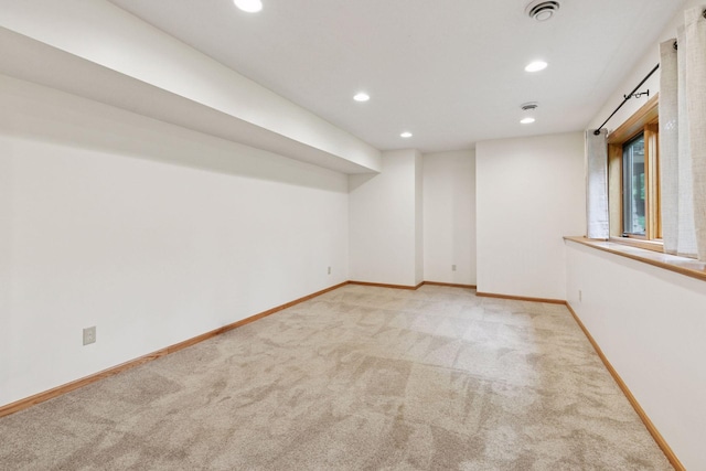1502 Rocky Ln, Eagan, MN 55122 - below grade area featuring light colored carpet, recessed lighting, and baseboards