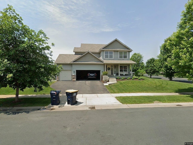 19801 Dover Dr, Farmington, MN 55024 - craftsman inspired home with a front yard, a porch, asphalt driveway, and a garage