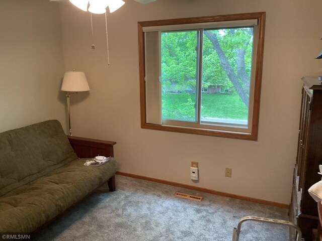 6800 Buckingham Ct, Woodbury, MN 55125 - living area with carpet floors, baseboards, and ceiling fan
