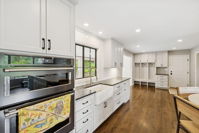 200 Marie Ave W, West Saint Paul, MN 55118 - kitchen featuring double oven, dark countertops, white cabinets, dark wood finished floors, and recessed lighting