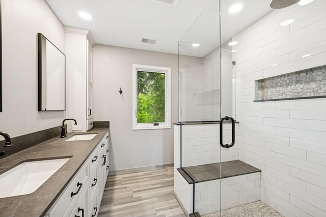 200 Marie Ave W, West Saint Paul, MN 55118 - full bathroom with a shower stall, wood finished floors, double vanity, and recessed lighting