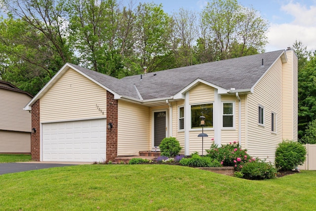 17698 Shore Ln W, Eden Prairie, MN 55346 - ranch-style home with asphalt driveway, an attached garage, a chimney, a front yard, and a shingled roof