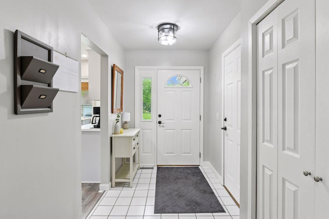 17698 Shore Ln W, Eden Prairie, MN 55346 - foyer featuring light tile patterned flooring and baseboards