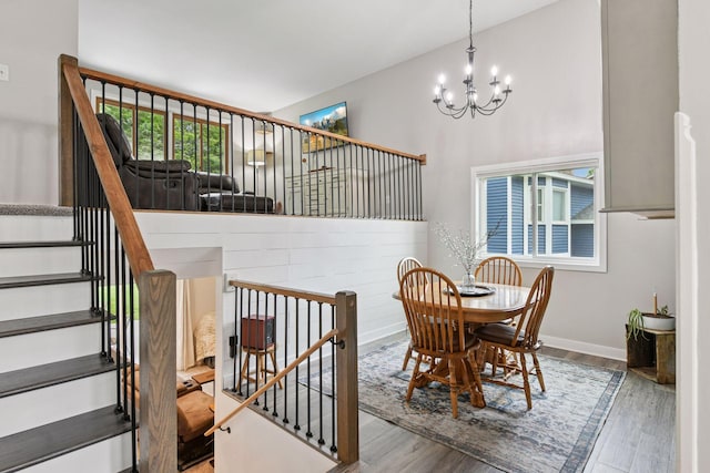 17698 Shore Ln W, Eden Prairie, MN 55346 - dining room with a chandelier, wood finished floors, healthy amount of natural light, and baseboards