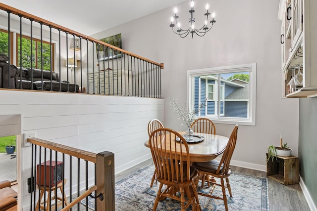 17698 Shore Ln W, Eden Prairie, MN 55346 - dining space featuring wood finished floors, a chandelier, and plenty of natural light