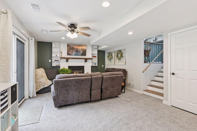 17698 Shore Ln W, Eden Prairie, MN 55346 - living area with a brick fireplace, light carpet, ceiling fan, stairs, and baseboards