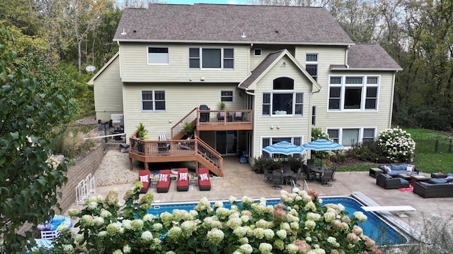 6539 Orchard Ridge Trl, Woodbury, MN 55129 - rear view of house with outdoor lounge area, stairway, a deck, an outdoor pool, and a patio area