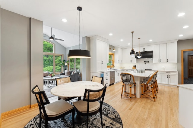 6539 Orchard Ridge Trl, Woodbury, MN 55129 - dining area with a ceiling fan, light wood-style flooring, recessed lighting, lofted ceiling, and baseboards