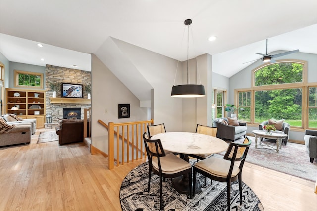6539 Orchard Ridge Trl, Woodbury, MN 55129 - dining area featuring plenty of natural light, vaulted ceiling, and light wood-type flooring