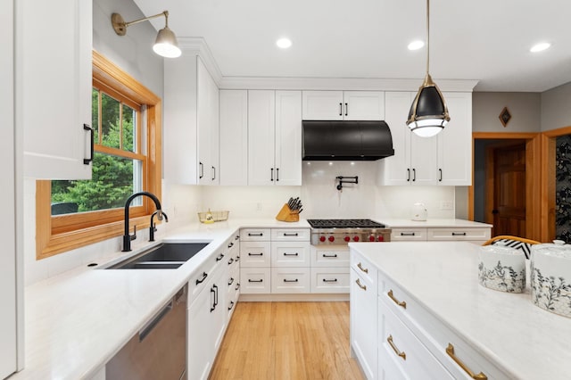 6539 Orchard Ridge Trl, Woodbury, MN 55129 - kitchen with stainless steel appliances, a sink, under cabinet range hood, light countertops, and white cabinets