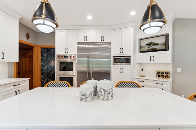 6539 Orchard Ridge Trl, Woodbury, MN 55129 - kitchen with built in appliances, a large island, white cabinets, light countertops, and recessed lighting