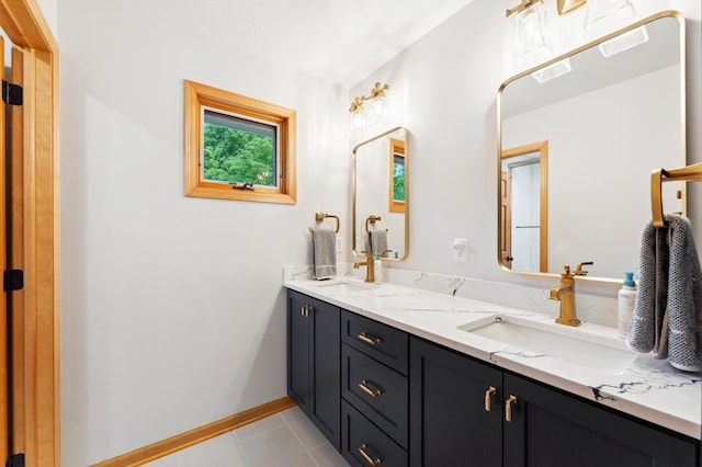 6539 Orchard Ridge Trl, Woodbury, MN 55129 - bathroom featuring double vanity, tile patterned flooring, and baseboards