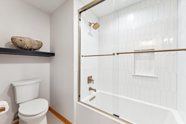 6539 Orchard Ridge Trl, Woodbury, MN 55129 - full bath featuring toilet, shower / bath combination with glass door, and baseboards