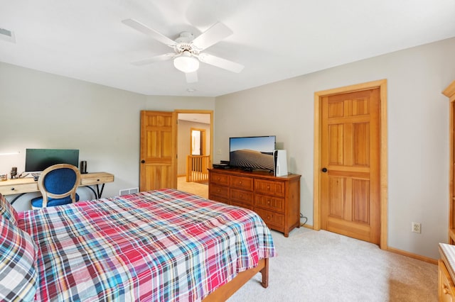 6539 Orchard Ridge Trl, Woodbury, MN 55129 - bedroom with light colored carpet, a ceiling fan, baseboards, and an office area