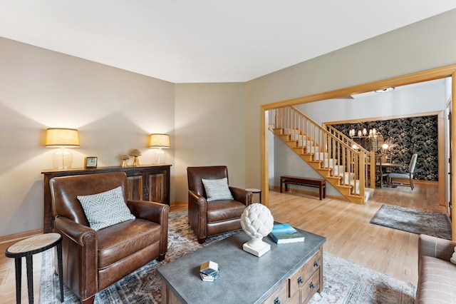 6539 Orchard Ridge Trl, Woodbury, MN 55129 - living area featuring stairway, wood finished floors, baseboards, and a chandelier