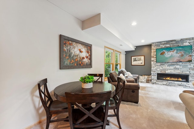 6539 Orchard Ridge Trl, Woodbury, MN 55129 - dining room featuring a fireplace, baseboards, recessed lighting, and light colored carpet
