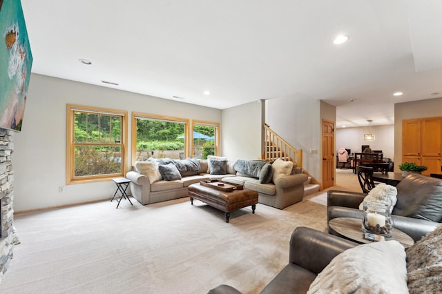 6539 Orchard Ridge Trl, Woodbury, MN 55129 - living room featuring stairway, light carpet, a stone fireplace, recessed lighting, and baseboards