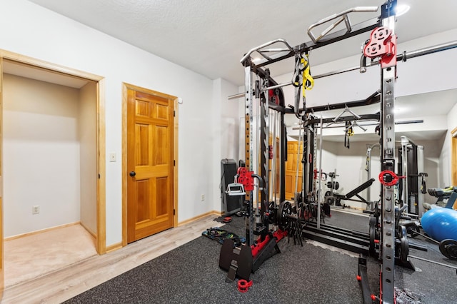 6539 Orchard Ridge Trl, Woodbury, MN 55129 - exercise area featuring wood finished floors and baseboards