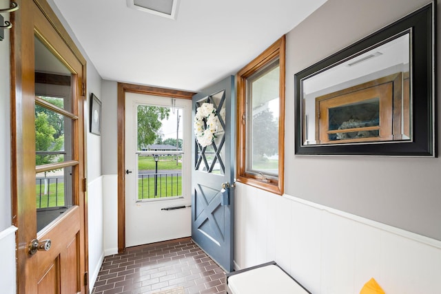 1305 Unity Ave N, Golden Valley, MN 55422 - entryway with brick patterned floors and a wainscoted wall