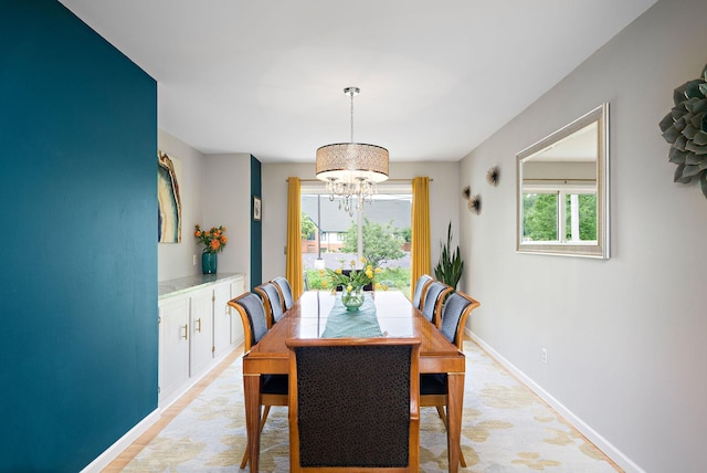1305 Unity Ave N, Golden Valley, MN 55422 - dining space featuring a chandelier and baseboards