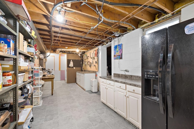 1305 Unity Ave N, Golden Valley, MN 55422 - unfinished basement featuring black fridge with ice dispenser