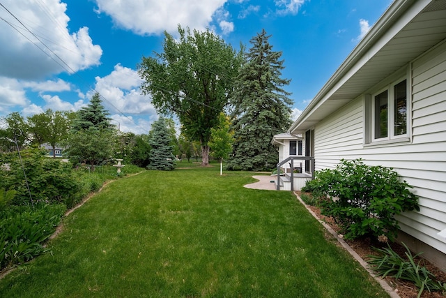 1305 Unity Ave N, Golden Valley, MN 55422 - view of grassy yard featuring a patio area