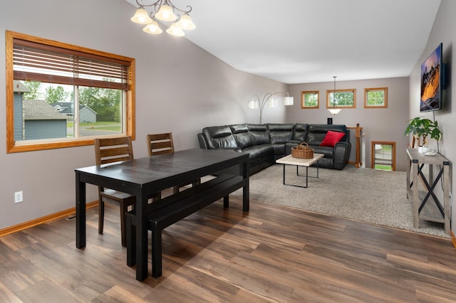 3138 Olympus Dr NE, Sauk Rapids, MN 56379 - living area featuring a chandelier, wood finished floors, and baseboards