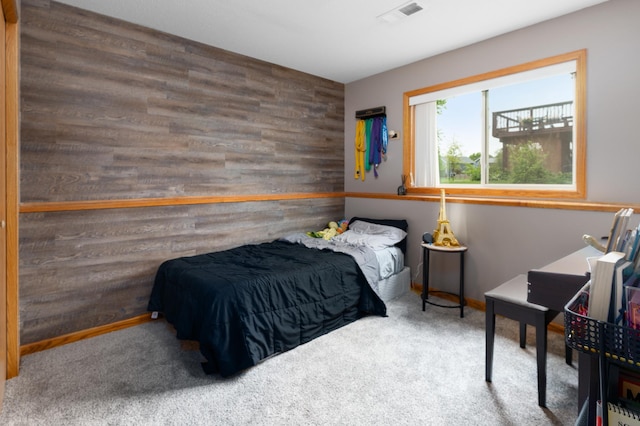 3138 Olympus Dr NE, Sauk Rapids, MN 56379 - carpeted bedroom featuring baseboards and wood walls