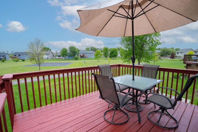 3138 Olympus Dr NE, Sauk Rapids, MN 56379 - deck with a residential view, outdoor dining area, and a lawn