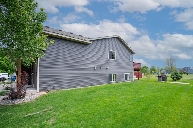 3138 Olympus Dr NE, Sauk Rapids, MN 56379 - view of home's exterior with a yard and a deck