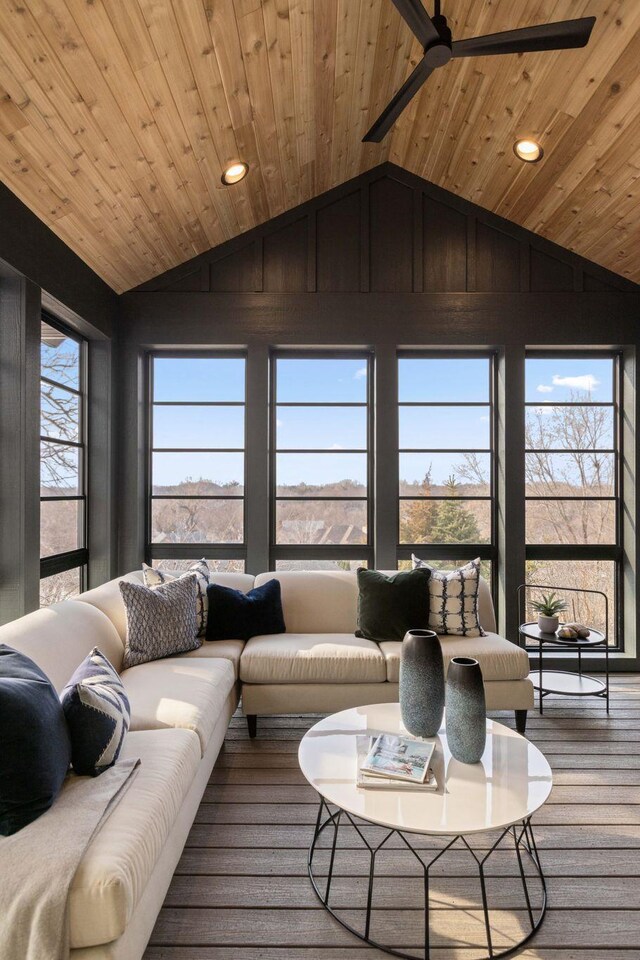 sunroom / solarium featuring vaulted ceiling