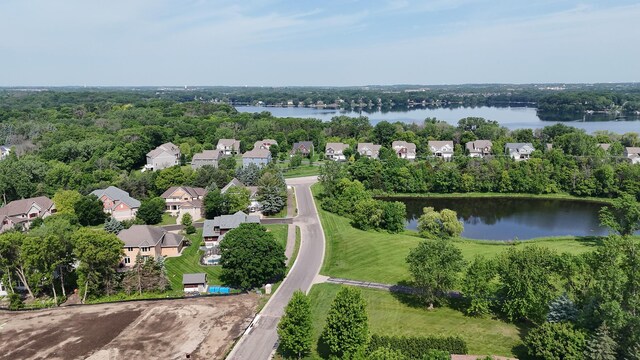 aerial perspective of suburban area with a large body of water