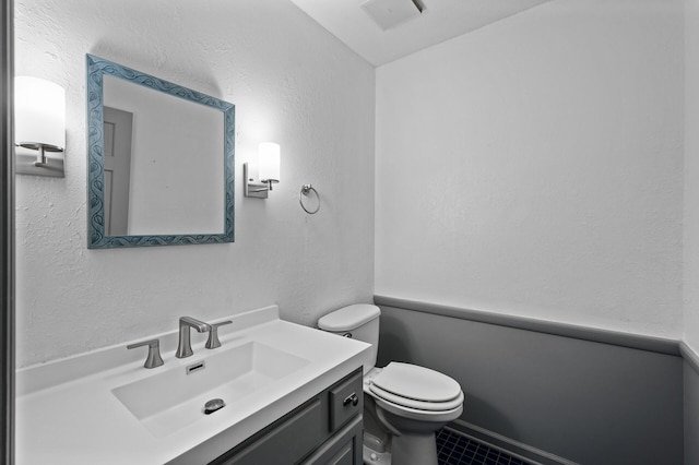 6331 Saint Croix Trl N, Stillwater, MN 55082 - half bathroom with vanity, toilet, and tile patterned floors